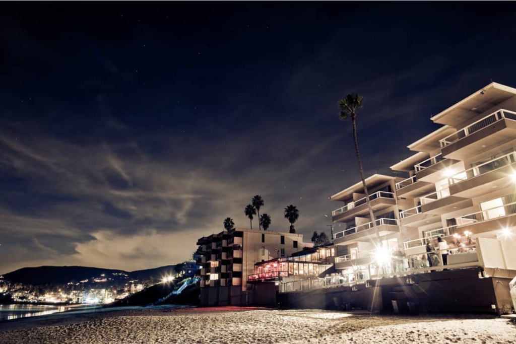 Nighttime view of Pacific Edge Hotel and Driftwood Kitchen in Laguna Beach