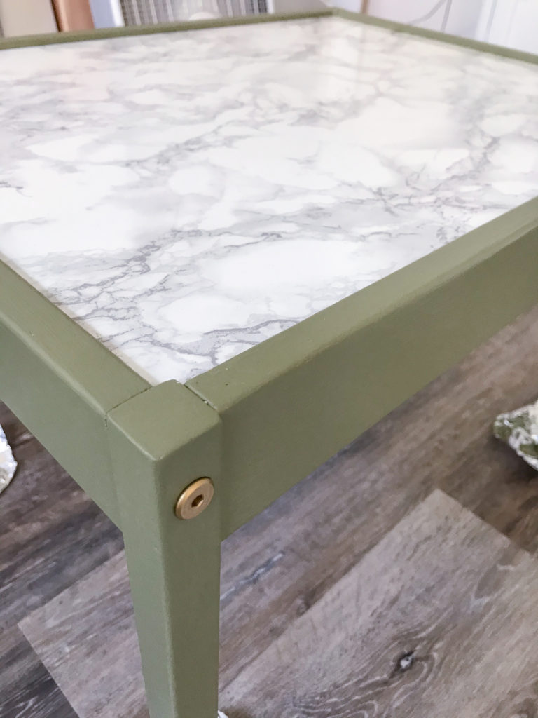 Ikea table with 'Olive Grove' by BM paint and marble contact paper tabletop.