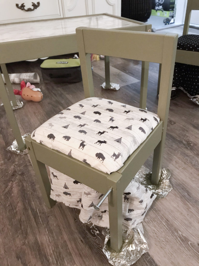 Ikea LATT chair hack with 'Olive Grove' by BM paint and white 'woodland animal' fabric cushions.