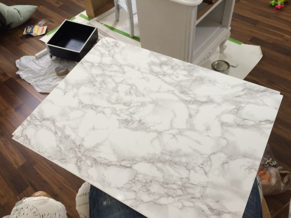 Covered the tabletop with marble con-tact paper