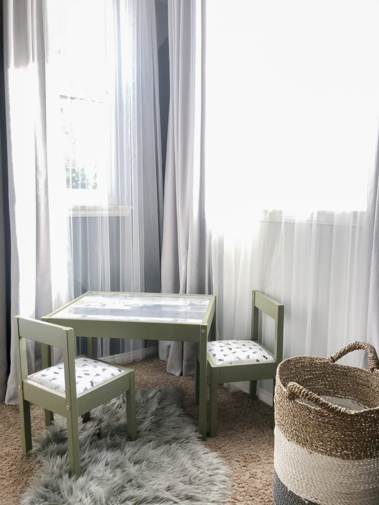 Ikea LATT table and chair hack for boys room with 'Olive Grove' by BM paint, white 'woodland animal' fabric cushions, and 'wood' wallpaper tabletop. 