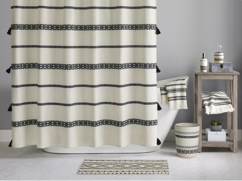 White and black patterned shower curtain from walmart.