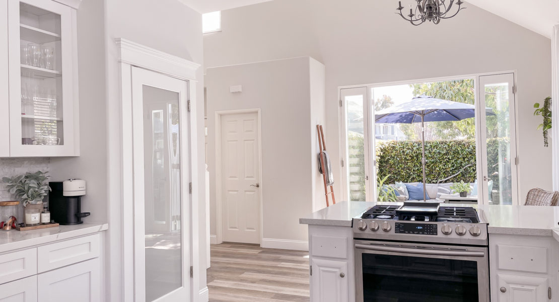 Kitchen remodel with wall removal, french door installation, and new cabinets & layout in kitchen.