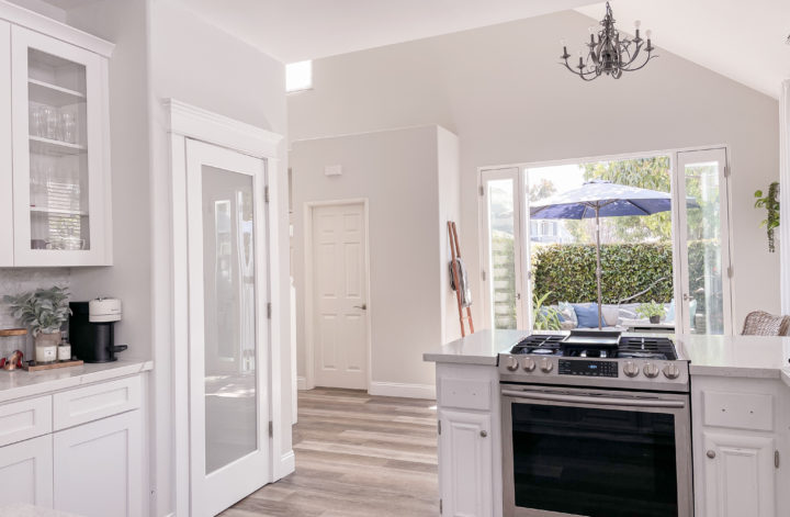 Kitchen remodel with wall removal, french door installation, and new cabinets & layout in kitchen.